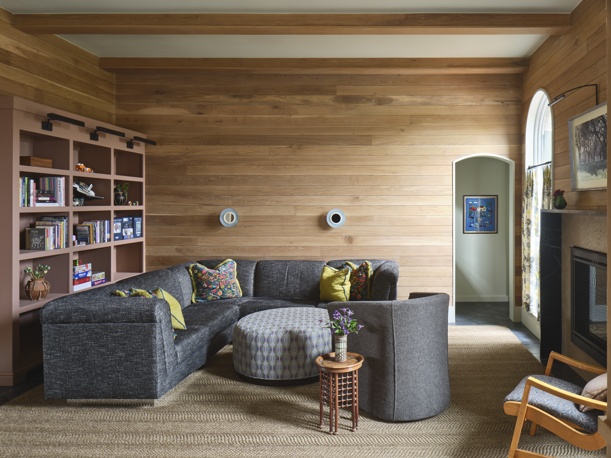 Warm living room with cedar shiplap walls and custom built-ins designed by Amity Worrel & Co. — aging-in-place interior design in Austin, TX