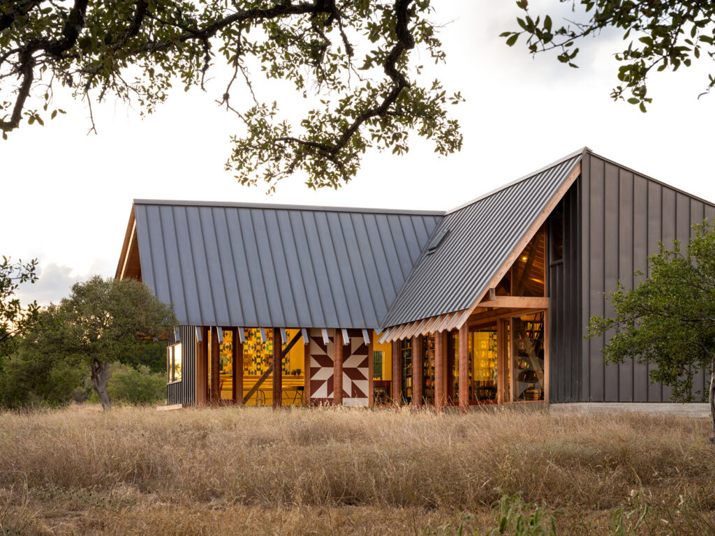 Custom Texas Hill Country home with metal roof and timber framing by Texas Construction Company — residential remodeling and aging-in-place specialist in Austin, TX